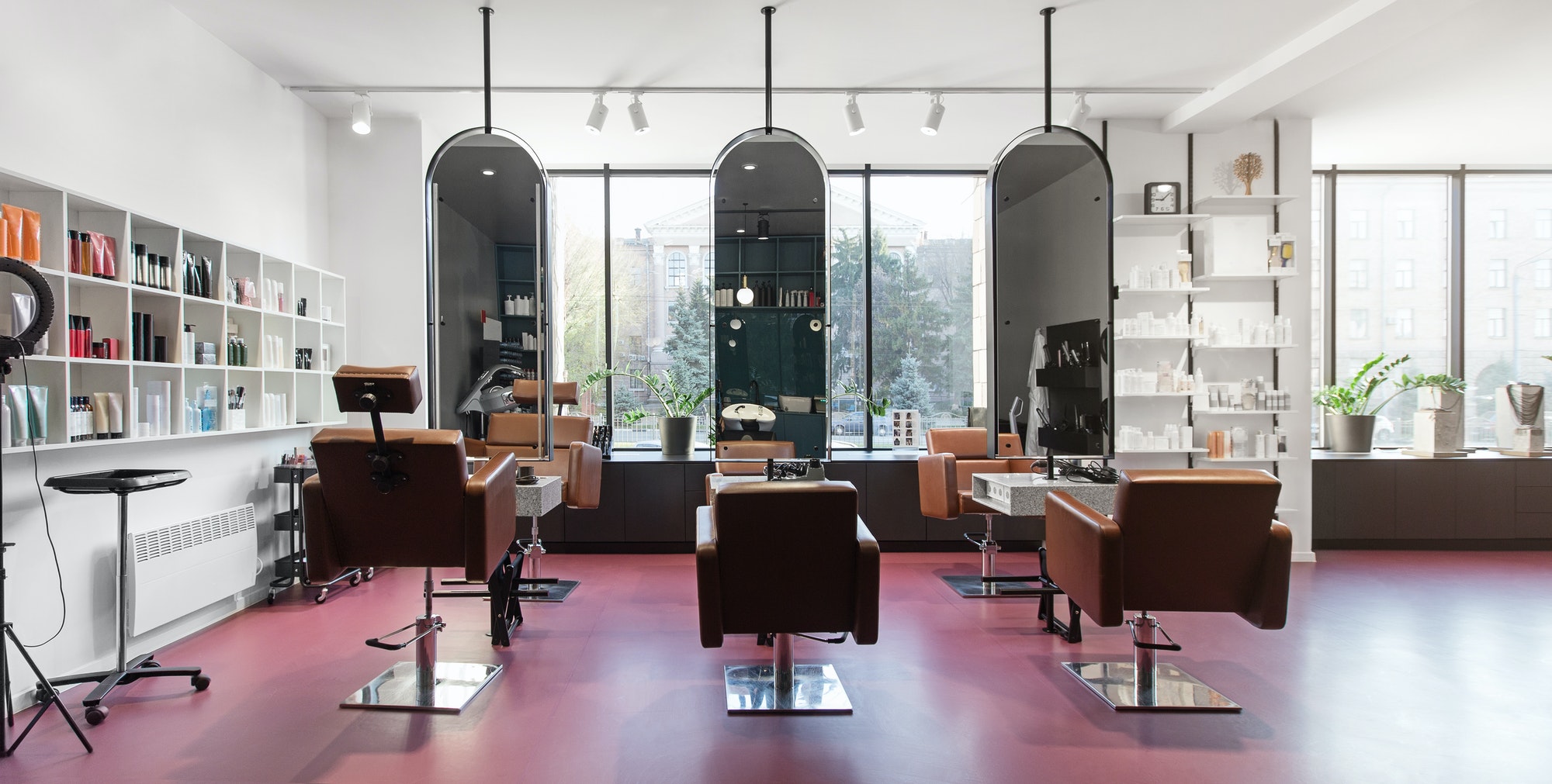 Chairs and mirrors in modern hairdressing, beauty salon